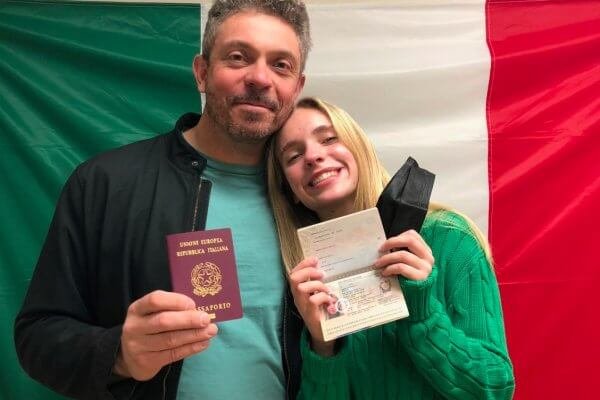 father and daughter with passports